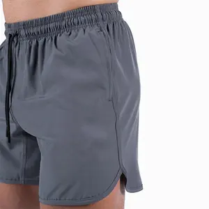 Celana pendek atletik 6 "Inseam cepat kering kain melar kualitas tinggi kebugaran polos Hem melengkung nilon celana pendek spandeks pria