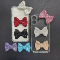 En gros, breloques de luxe scintillantes avec motifs nœud, signe du dollar, rose, rouge, bleu, noir, argenté, pour coques de téléphone, coques d'iPad, style Kawaii et artisanat DIY