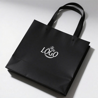 Sacs à provisions de luxe avec logo personnalisé estampage de feuille d'argent ruban de sacs en carton noir écologique pour des promotions personnalisées votre