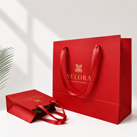 Sac de shopping en papier d'art élégant et luxueux avec estampage à chaud doré pour les boutiques de vêtements et l'emballage de cadeaux
