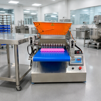 Machine de remplissage semi-automatique de pâte à gâteau et de bonbons gélifiés pour table, idéale pour les boulangeries et ateliers.
