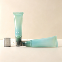 Tube souple rond en plastique noir personnalisé de 50 g, tube de 50 ml pour fond de teint et crème pour les yeux avec pompe sans air