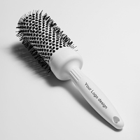 Brosse ronde de beauté à revêtement en céramique ionique de conception personnalisable avec poils et matériau en nylon Emballage personnalisé