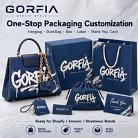 Tas Selempang Pria Modern Bahan Denim Beludru Bentuk Bulat dengan Aksen Metalik, Pegangan Atas, Cocok untuk Perjalanan dan Aktivitas Sehari-hari, OEM ODM