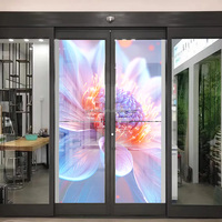 Panneau vidéo OLED Hd Écran transparent de porte automatique 55 pouces 2k Machine publicitaire à affichage OLED pour portails de porte