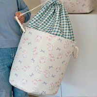 Panier de rangement pliable en toile à motif lapin avec poignée en corde, idéal pour vêtements, jouets ou linge sale
