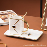 Tasse à café et soucoupe modernes en or Tasse en céramique en porcelaine au design créatif en forme de sac avec finition brillante Retour à l'école