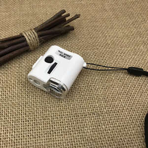 عدسة مكبرة محمولة 60 مرة مع ضوء LED وأشعة فوق بنفسجية لقراءة الصحف والمجوهرات مع حزام تعليق - Product Image 1