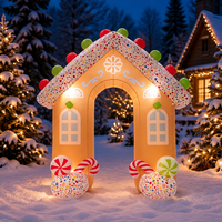 Arche gonflable en forme de maison de pain d'épices de Noël avec des bâtons de sucre et des sucettes pour la décoration d'entrée d'événements festifs