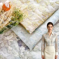Tissu en dentelle d'organza 100% nylon brodé de fleurs de style national à double couche pour vêtements de couture féminins