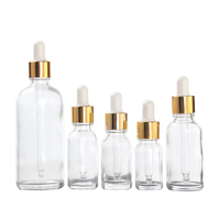 Vente en gros de flacons compte-gouttes en verre pour huiles essentielles de 5 ml à 100 ml avec couvercle en bambou, compte-gouttes doré, impression sérigraphique, couleur personnalisée