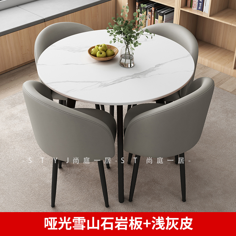 Tavolo in ardesia opaca da 80 cm + 4 sedie, rivestite in pelle grigio chiaro.