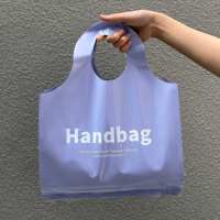 Moda popüler özel Logo renkli kolu halat PE T-shirt plastik kılıf çanta için giysi ambalajı alışveriş