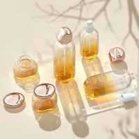 Ensemble de produits de soin de la peau haut de gamme, flacon en verre ovale 30 ml 50 ml, flacon d'essence avec tête de pompe 30 g 50 g, pot à crème avec couvercle doré