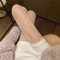 Collants sexy pour femmes, à motif lettres, en résille, avec coutures discrètes, à bout couvert, en nylon ajouré et velours, tendance et uniques