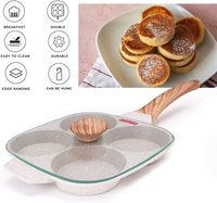 Poêle à frire antiadhésive en pierre médicale au design moderne 4 tasses, avec couvercle, spatule à brosse et quatre trous pour les œufs.