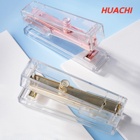 Agrafeuse manuelle transparente en plastique standard, marque HUACHI, modèle 268, capacité 24/6-100 agrafes, poids 150g, profondeur de la gorge 60mm, Zhejiang