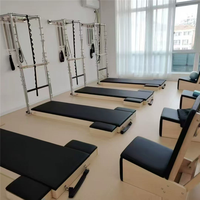 Tour de Pilates murale complète avec lit d'entraînement et accessoires pour studio de yoga