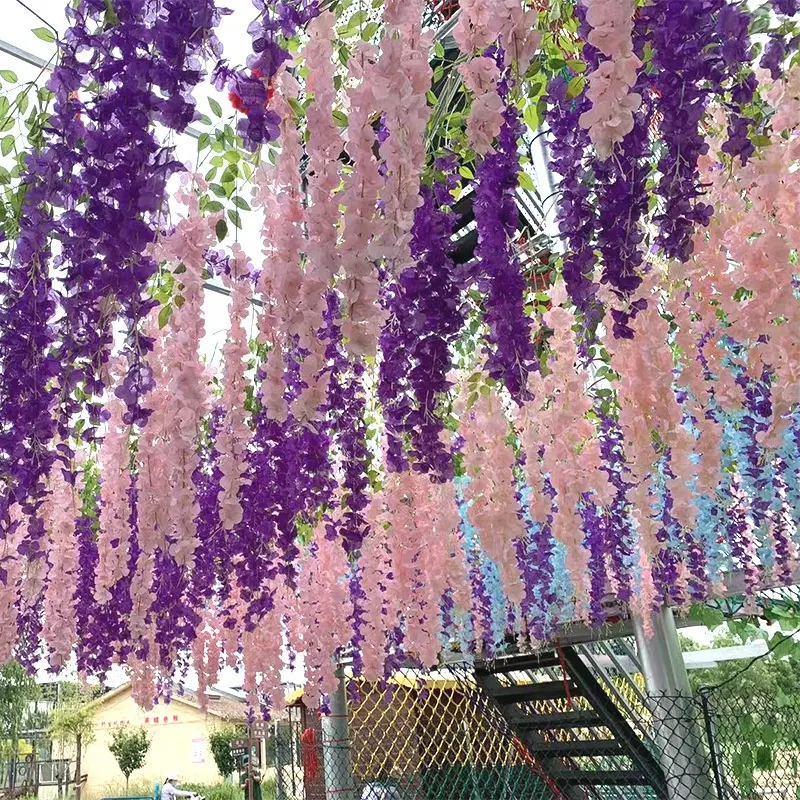 Flores colgantes de glicinia artificiales de vides de seda colgantes al por mayor para la decoración de la pared del arco del hogar de la boda