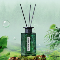 Ensemble diffuseur de roseau de luxe classique bouteille en verre vert parfum de maison avec 4 bâtons noirs pour la décoration de la chambre