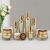 Flacons en acrylique pour cosmétiques, sérum, lotion, crème pour le visage, fond de teint, avec bouchon en plastique doré en forme de fleur, pot cylindrique en stock