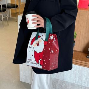 Sac cadeau de Noël portable isotherme pour la veille de Noël, emballage à emporter en tissu non tissé et feuille d'aluminium, motif Père Noël et bougie artisanale - Product Image 1