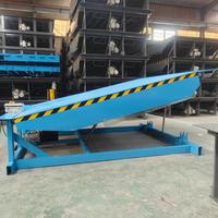 Plateforme élévatrice industrielle automatique pour entrepôts et logistiques, avec fonctions de chargement et de déchargement