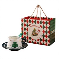 Ensemble tasse et soucoupe en céramique Anji Newell pour Noël avec design de dessin animé, conservation de la chaleur, couleur et logo personnalisés, emballage en boîte cadeau