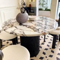 Mesa de comedor redonda de mármol francés estilo crema con base completa, diseño elegante y retro, ideal para casas pequeñas