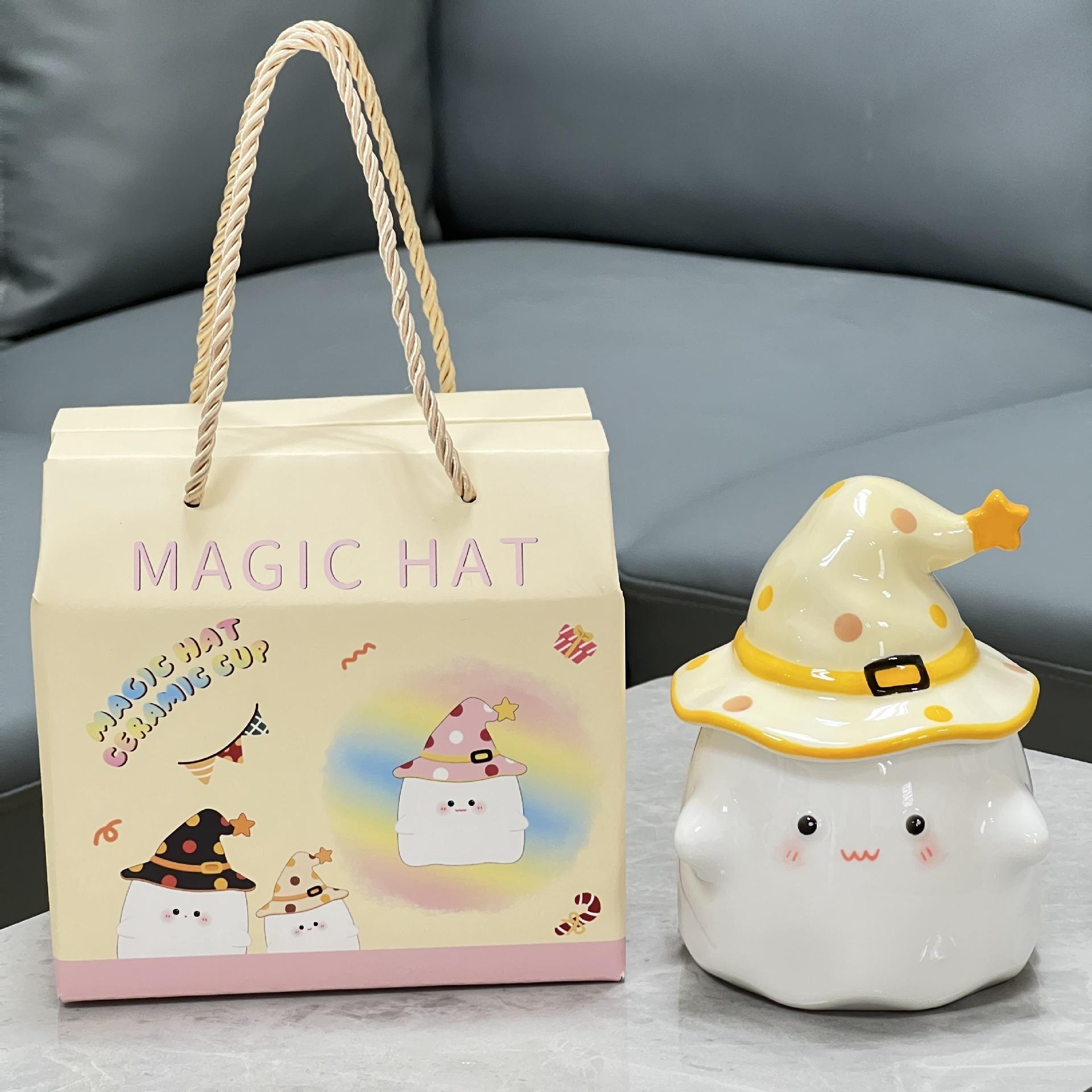 Caja de regalo pequeña con tapa de vaso mágico amarillo para fiestas.