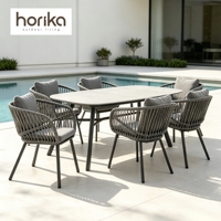 Ensemble de mobilier de jardin moderne pour villa européenne : chaises de patio, table à manger en corde tressée pour hôtel et extérieur