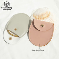 Sac de voyage en cuir PU personnalisé HKSLW, vente directe d'usine, sac d'emballage de bijoux de luxe avec bouton-pression, pochettes pour colliers et bagues