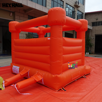Château gonflable orange vif en PVC commercial durable, idéal pour toutes sortes de fêtes et d'événements