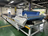 Machine de découpe et d'étalement de tissu intégrée à commande PLC entièrement automatique à double ligne pour le textile domestique