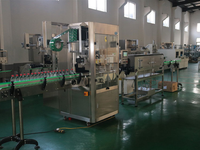 Machine d'étiquetage automatique des manchons pour bouteilles, canettes, emballages en plastique et en verre