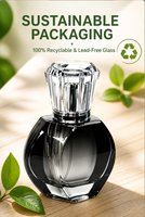 Flacon de parfum cylindrique en verre haut de gamme à motif marbre noir et or, texture haut de gamme, sérigraphie, marquage à chaud, finition mate