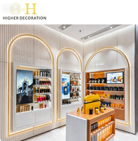 Élégante vitrine de présentation de parfums pour boutique de cosmétiques, comptoir personnalisé en verre pour produits cosmétiques