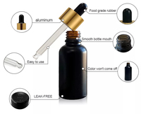 Flacons compte-gouttes en verre cosmétique pour huiles essentielles de 20 ml et tube en papier noir personnalisé