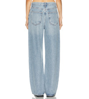 Jean ample taille basse bleu clair délavé style vintage pour femme, coupe décontractée avec braguette boutonnée, idéal pour le streetwear.