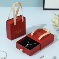 Nouvel emballage de bijoux 2026 avec insert en éponge, boîtes à bijoux personnalisées avec logo et poignée en ruban, emballage élégant pour boucles d'oreilles
