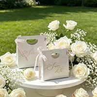 Custom Luxury Eco-Friendly Art Paper Gift Bag with Hot Stamping and Ribbon for Wedding Chocolate Candy Box
