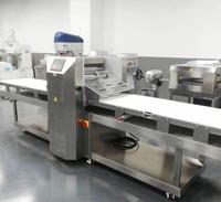 Machine à découper la pâte en continu pour les enveloppes de cornets, les tartes aux œufs, les enveloppes de raviolis, polyvalente pour divers équipements de boulangerie