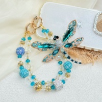 Breloque de téléphone perlée fleur bleue, cordon de poignet double couche pour téléphone, perles imitation nacre, porte-clés fait main, pendentif de sac, décoration