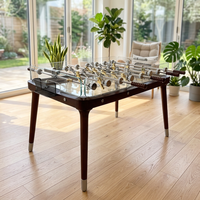 Table de baby-foot professionnelle de luxe avec plateau en verre trempé et tiges chromées pour hall d'hôtel et salle de jeux