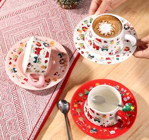 Christmas Ceramic Cup and Saucer Set with Santa Claus Cartoon Design, Red and Pink Handles, Holiday <b>Drinkware</b> for Coffee or Tea - Product Image 1