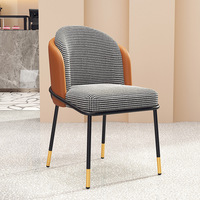 Chaise de salle à manger de luxe en pierre à motif pied-de-poule avec pieds en métal doré en forme d'arachide pour usage en restaurant