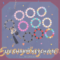 Femmes UV imprimé Silicone perlé Bracelet cristal jante gland clé breloque sac sac à main pendentif auto-défense porte-monnaie porte-clés