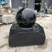 Fontaine sphérique de luxe en marbre noir, sculpture d'extérieur, décoration paysagère de jardin, œuvre d'art en pierre sur mesure pour villa