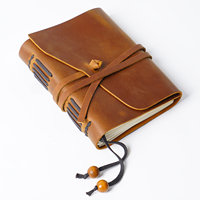 AIGUONIU Vintage Real Leather A5 Notebook Diario de viaje de piel de vaca de capa superior hecho a mano con correa de cierre y páginas recargables