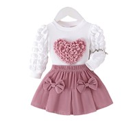 Ensemble 2 pièces décontracté et mignon pour filles : Haut côtelé à col rond et manches longues bouffantes avec patch cœur 3D et jupe-short plissée à double nœud et taille élastique